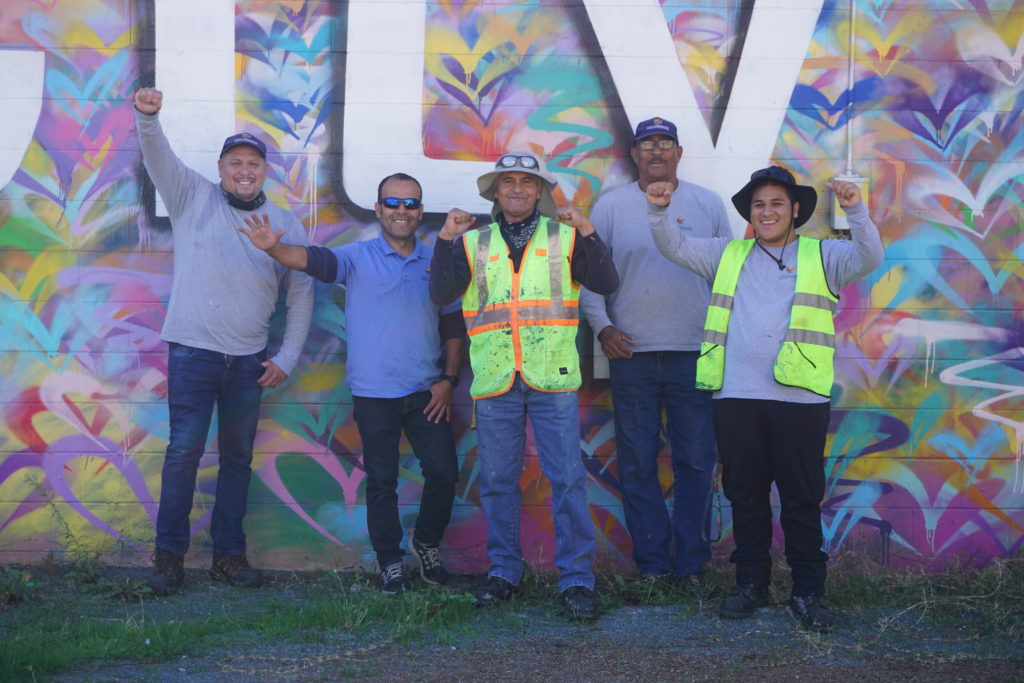 CHBA Clean Up Crew in front of Love City Heights mural