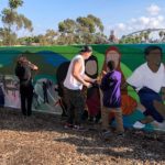 Artists working on the Teralta Park Unity in Community Mural
