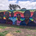 Portion of Teralta Park Unity in Community Mural featuring images of people from the City Heights community
