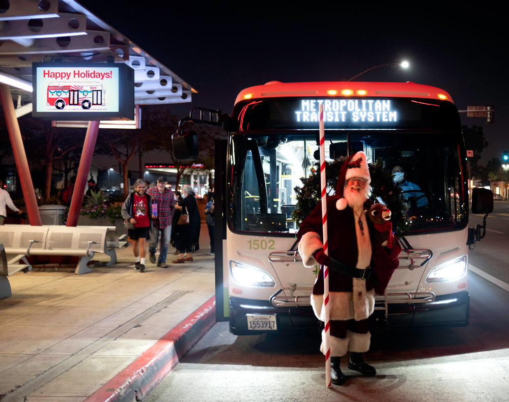 Santa in front of a San Diego MTS bus