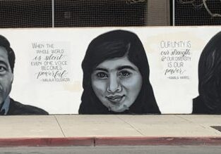 Urban wall mural depicting famous modern-day heroes, including Rosa Parks, Kamala Harris, and Malala Yousafzai.